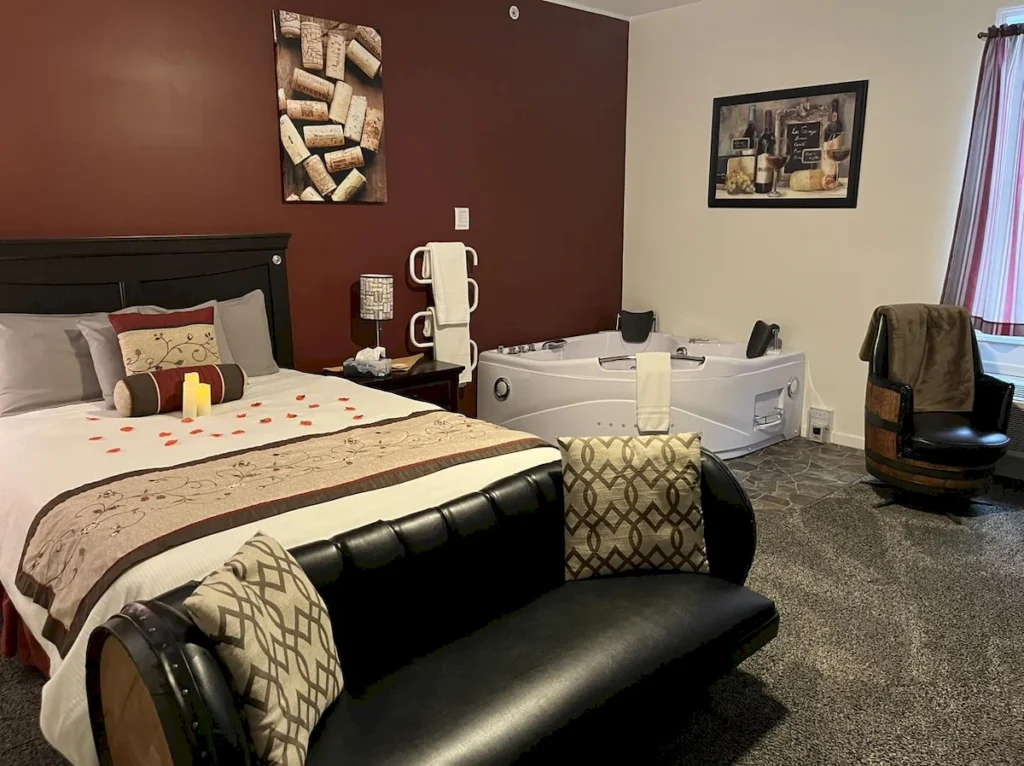 the vintner's room, in room hot tub & bed at the inn | brooks estate