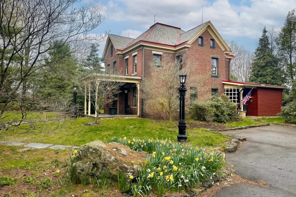 Compare Estates woodland manor view from side front yard