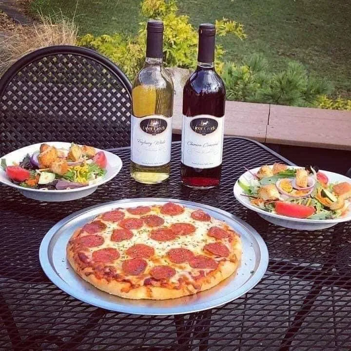 Enjoy the Café Experience at Brooks Estate Winery Pepperoni pizza paired with Deer Creek wine and side salads at the Brooks Estate winery café in Shippenville, Pennsylvania
