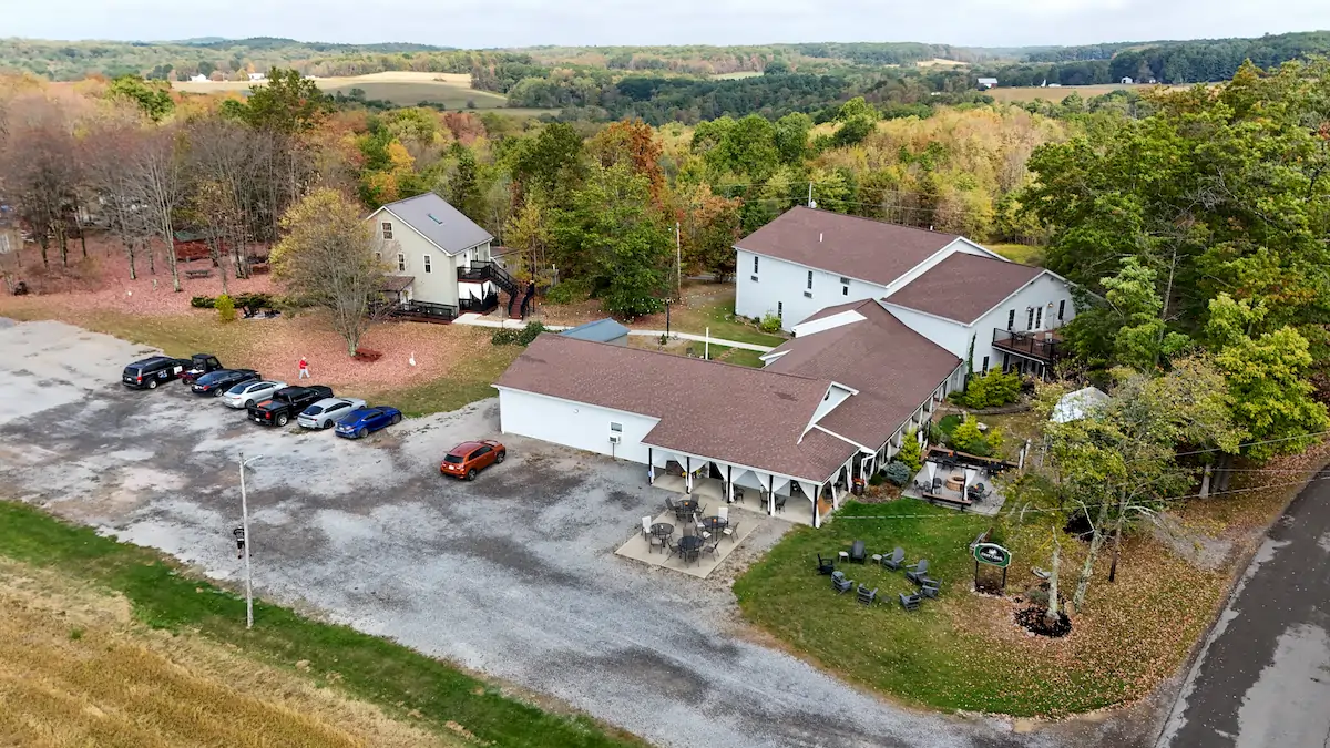 Compare Estates Deer Creek Winery at Brooks Estate aerial view of The Inn, Event Center, The Manor, Winery and outdoor seating