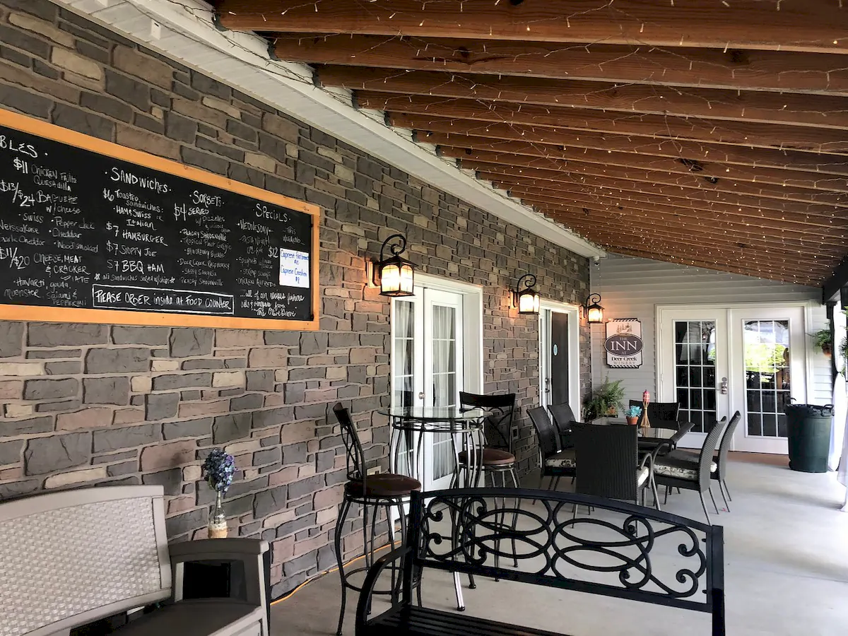Compare Estates vino's den at brooks estate east porch at deer creek winery