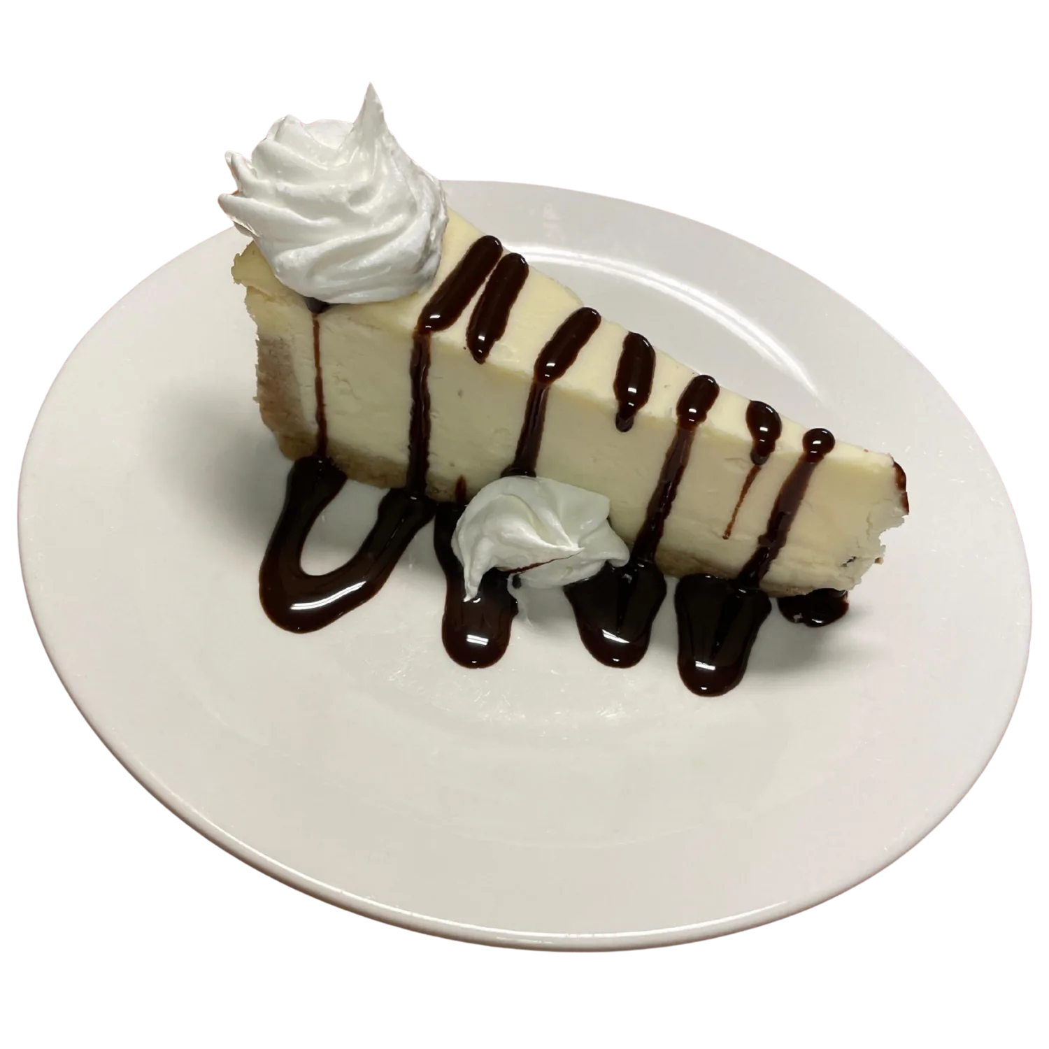 Classic cheesecake with chocolate sauce and whipped cream at Deer Creek Winery Café
