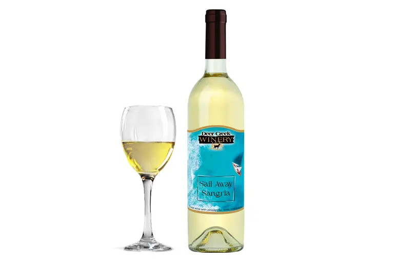 Sail Away Sangria: The Tropical Pennsylvania Wine That Feels Like Summer in a Glass Bottle of Sail Away Sangria from Deer Creek Winery beside a glass of chilled sangria