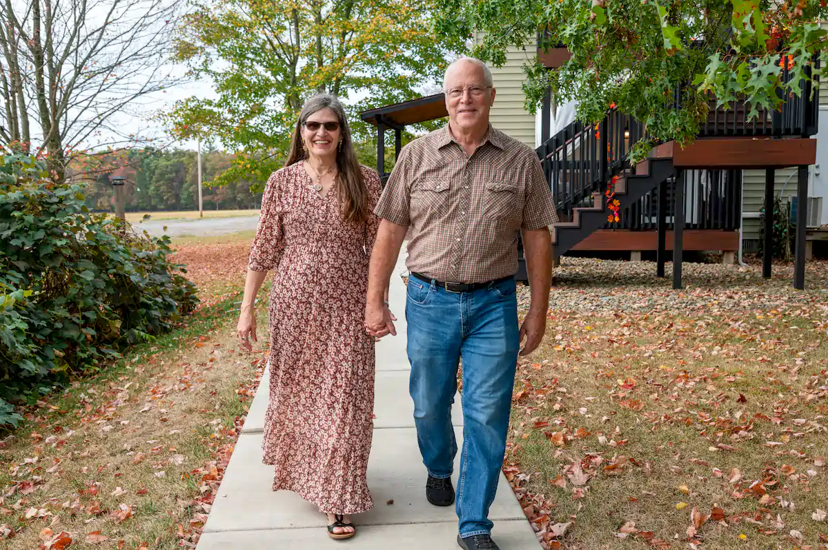 Our Story denny and rhonda brooks walking in the courtyard at brooks estate at deer creek winery