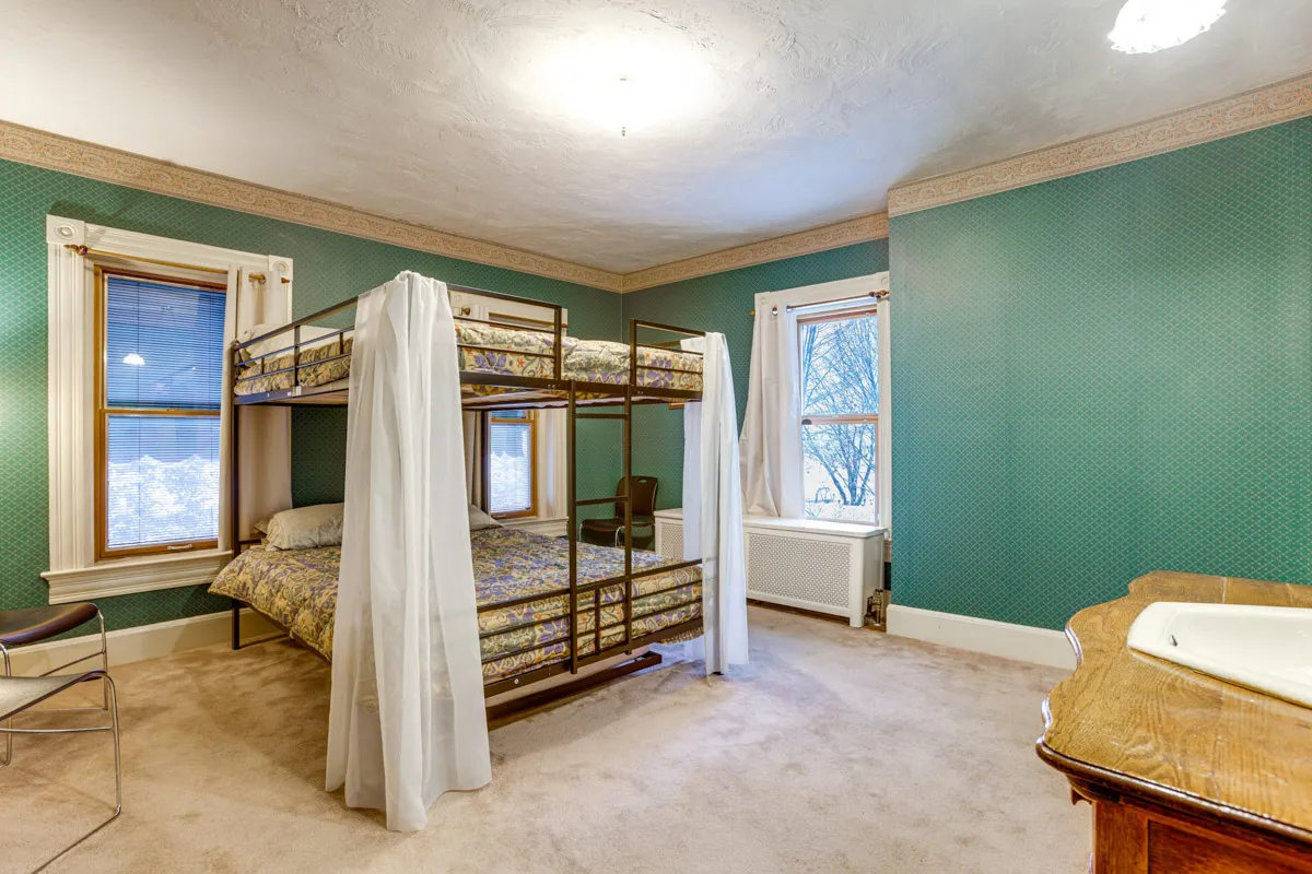 woodland manor The Green room with bunk Q beds and trundle Twin bed view from entry way