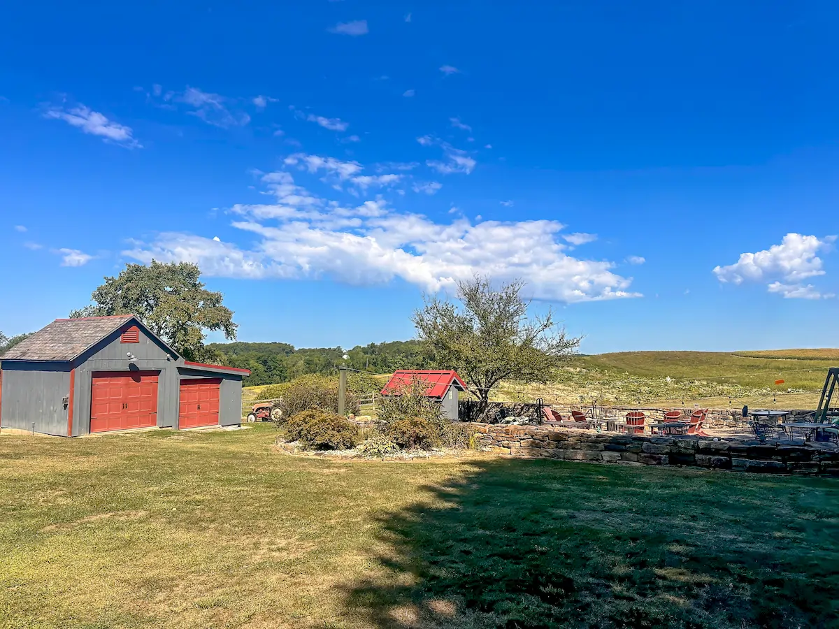 watson estate back area with sheds and fire pit