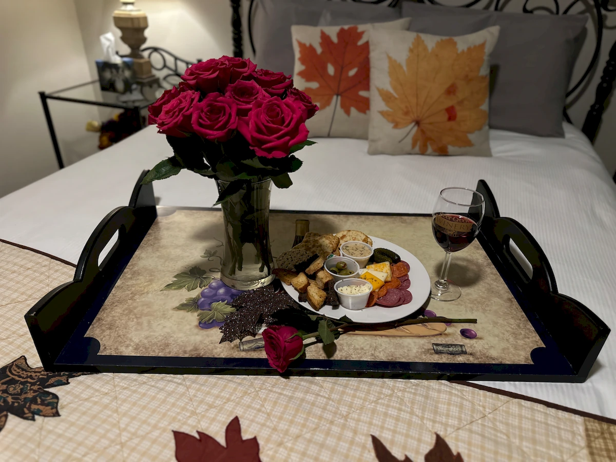 autumn in italy room, tray of breakfast and flowers on bed