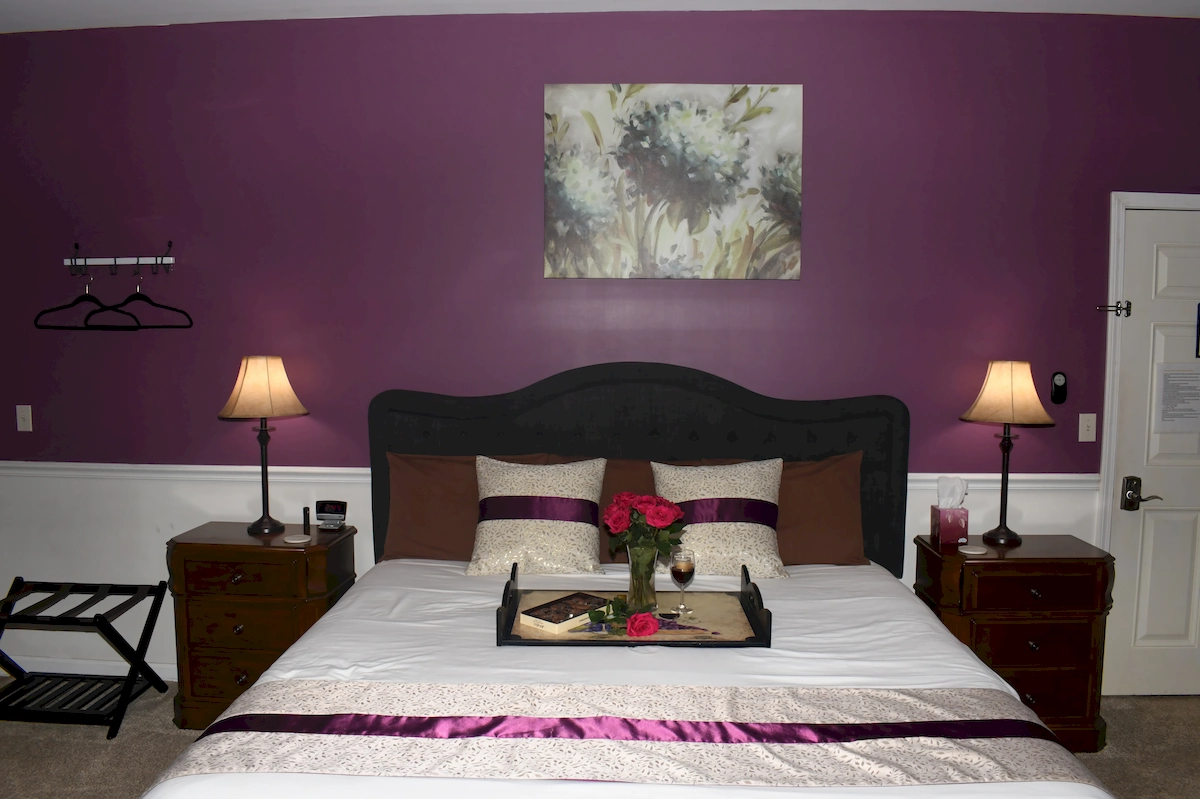 brooks deluxe room, bed with flowers and chocolate