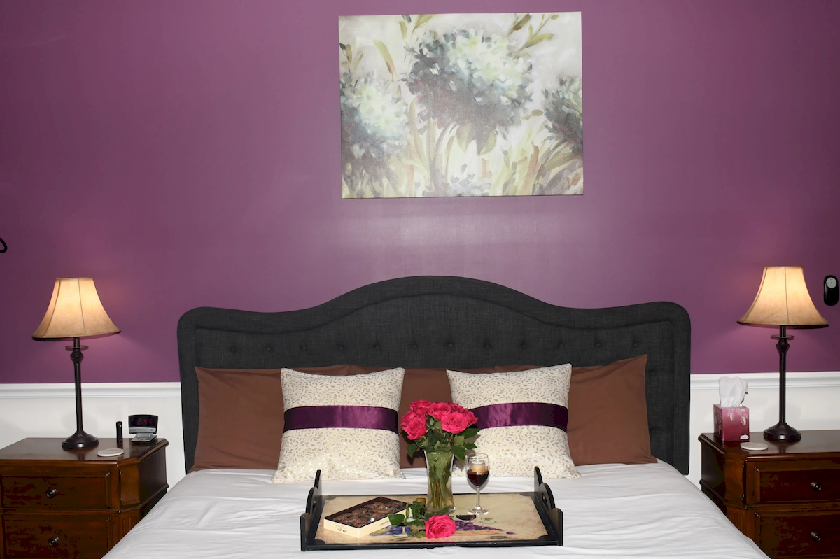 brooks deluxe room, bed with flowers and chocolate