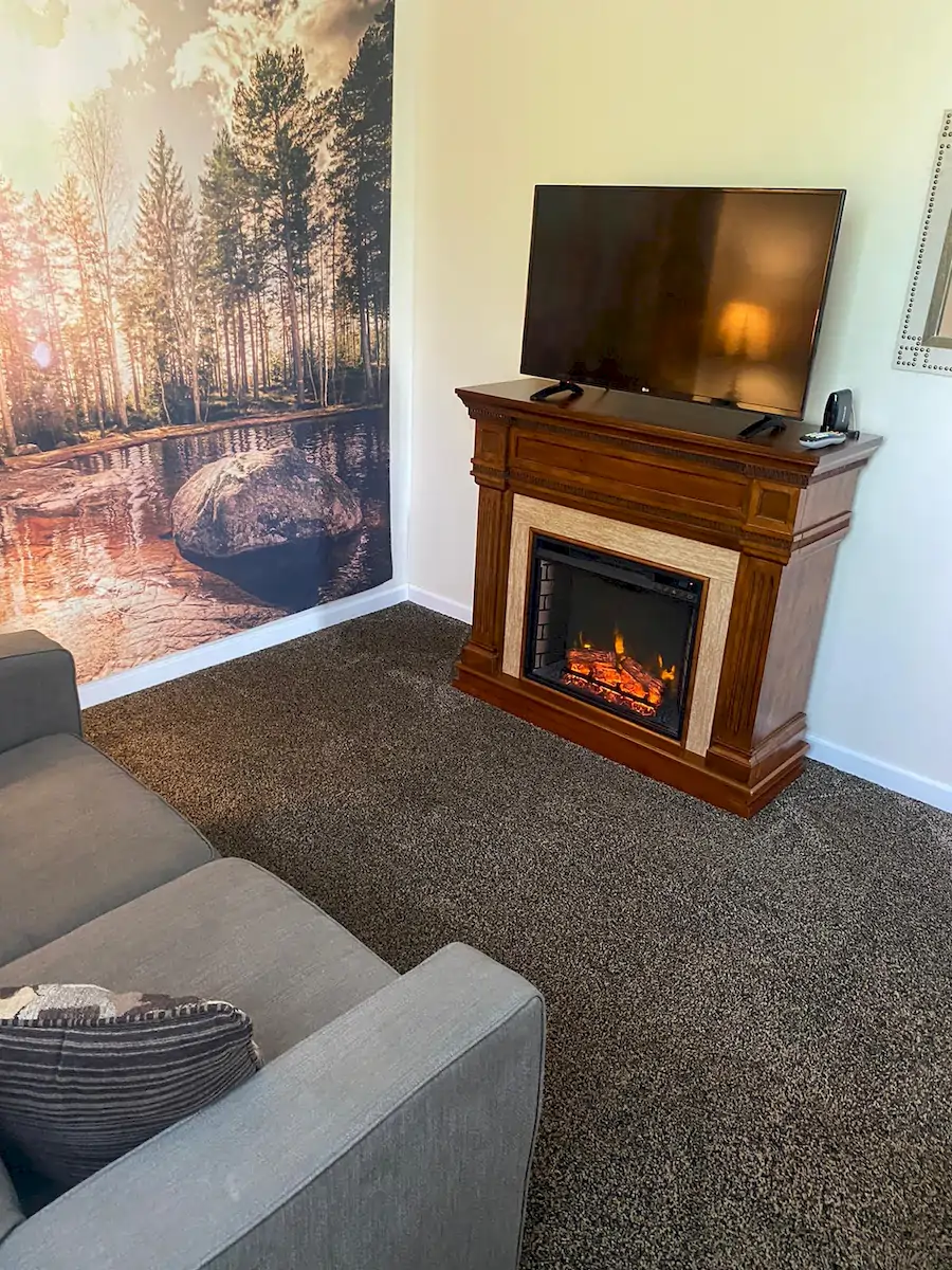 deer creek room, view from raised platform of tv and electric fireplace