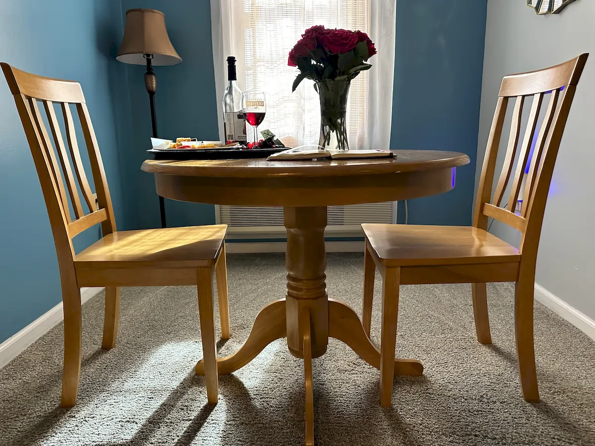 summer in california room, table with flowers, breakfast and chairs
