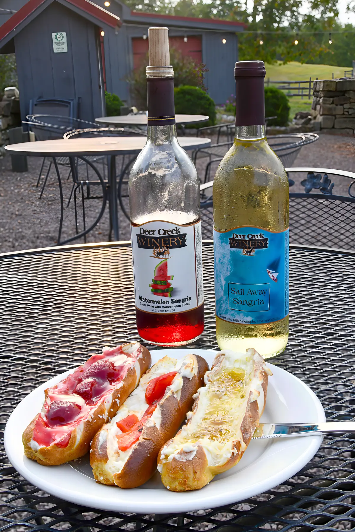 two deer creek bottles of wine and a pretzel flight by the firepit