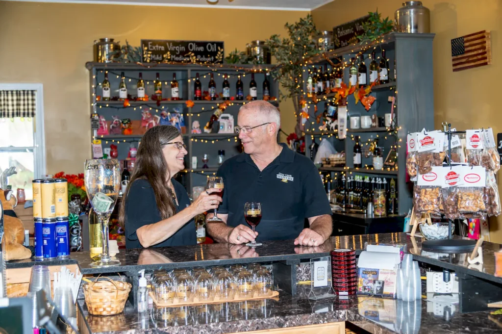 denis and rhonda brooks at vino's den | deer creek winery at brooks estate