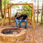 denis and rhonda brooks sitting at the outside area by firepits at brooks estate