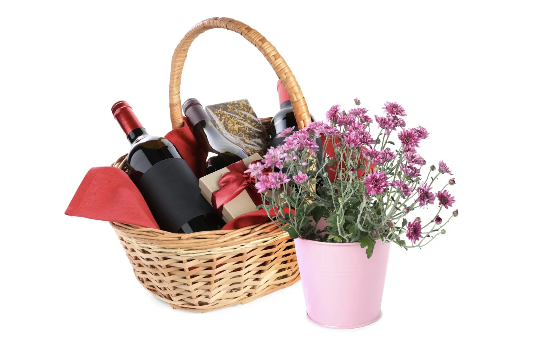 Wine gift basket with bottles of wine, wrapped gift box, and pink flowers for Mother's Day winery getaway