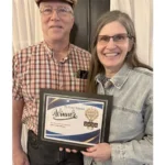 Deer Creek Winery team holding The Leader-Vindicator 2026 Readers Choice Winner plaque for Best Brewery Winery Experience