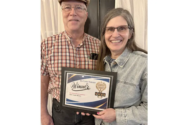 Deer Creek Winery team holding The Leader-Vindicator 2026 Readers Choice Winner plaque for Best Brewery Winery Experience