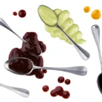 Variety of sauces and dipping blends on spoons — illustrating the range of olive oil and balsamic combinations