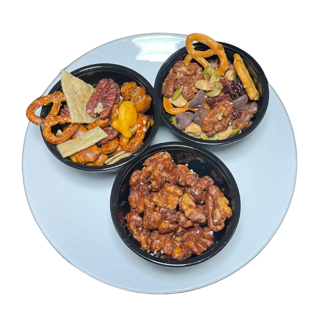 The Deer Creek Pairing Experience Trio of Deer Creek Winery snacks — Sweet & Savory Nut Duo, Sunset Harvest Trail Mix, and Winehouse Bar Mix